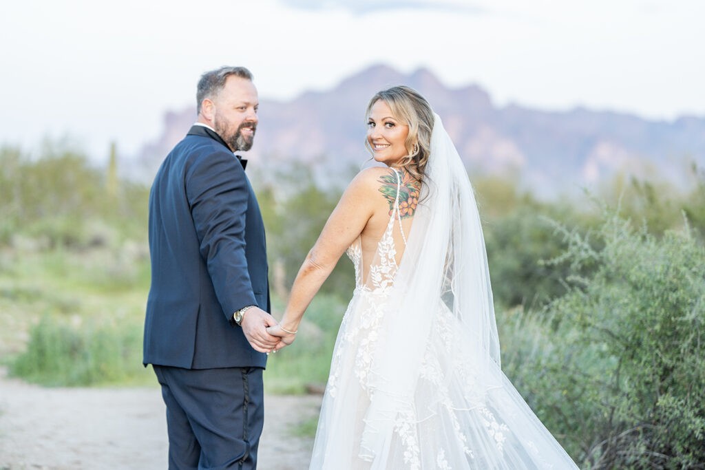  Bride and groom holding hands in the Arizona desert, on their wedding day: Wedding photos. 